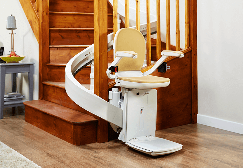 curved stairlift at base of stairs