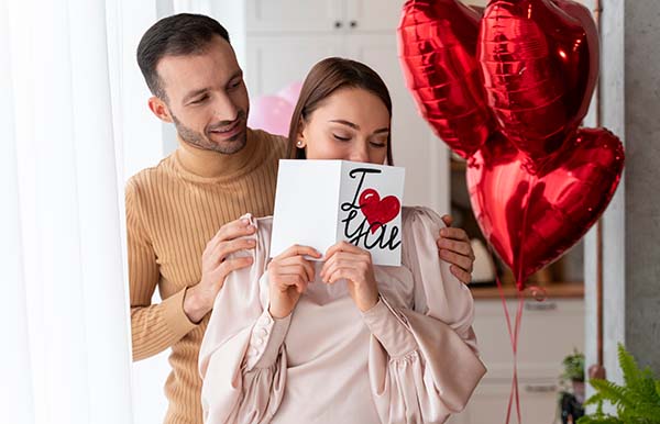 couple exchanging gifts for valentines day